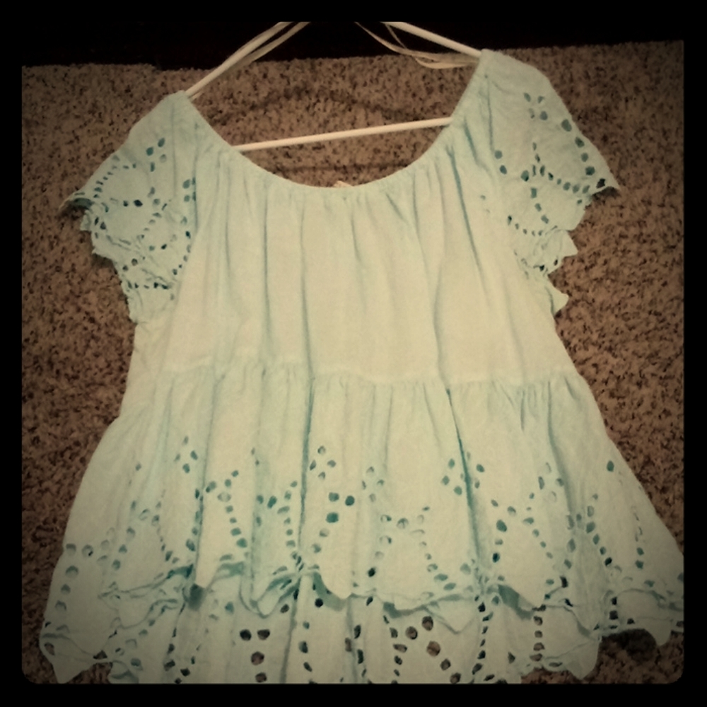Blue off the shoulder shirt.